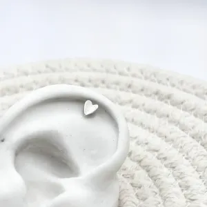 PIERCING PÉ DE AÇO INOX COM CORAÇÃO LONGO DE PRATA925