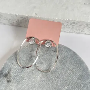 BRINCO OVAL COM PEDRA DE ZIRCONIA