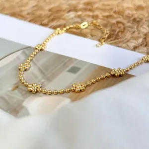 TORNOZELEIRA BOLINHA COM FORMATO DE FLORES