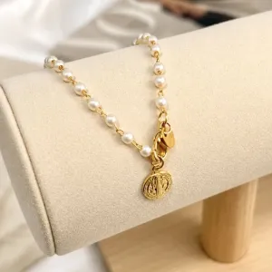 PULSEIRA PÉROLA COM MEDALHA DE SÃO BENTO