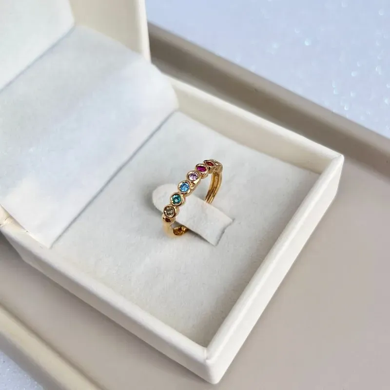 ANEL AJUSTÁVEL 7 PEDRAS COLORIDAS - CRAVAÇÃO INGLESA