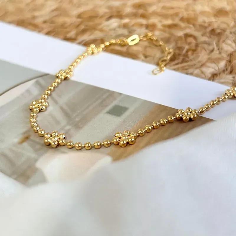 TORNOZELEIRA BOLINHA COM FORMATO DE FLORES