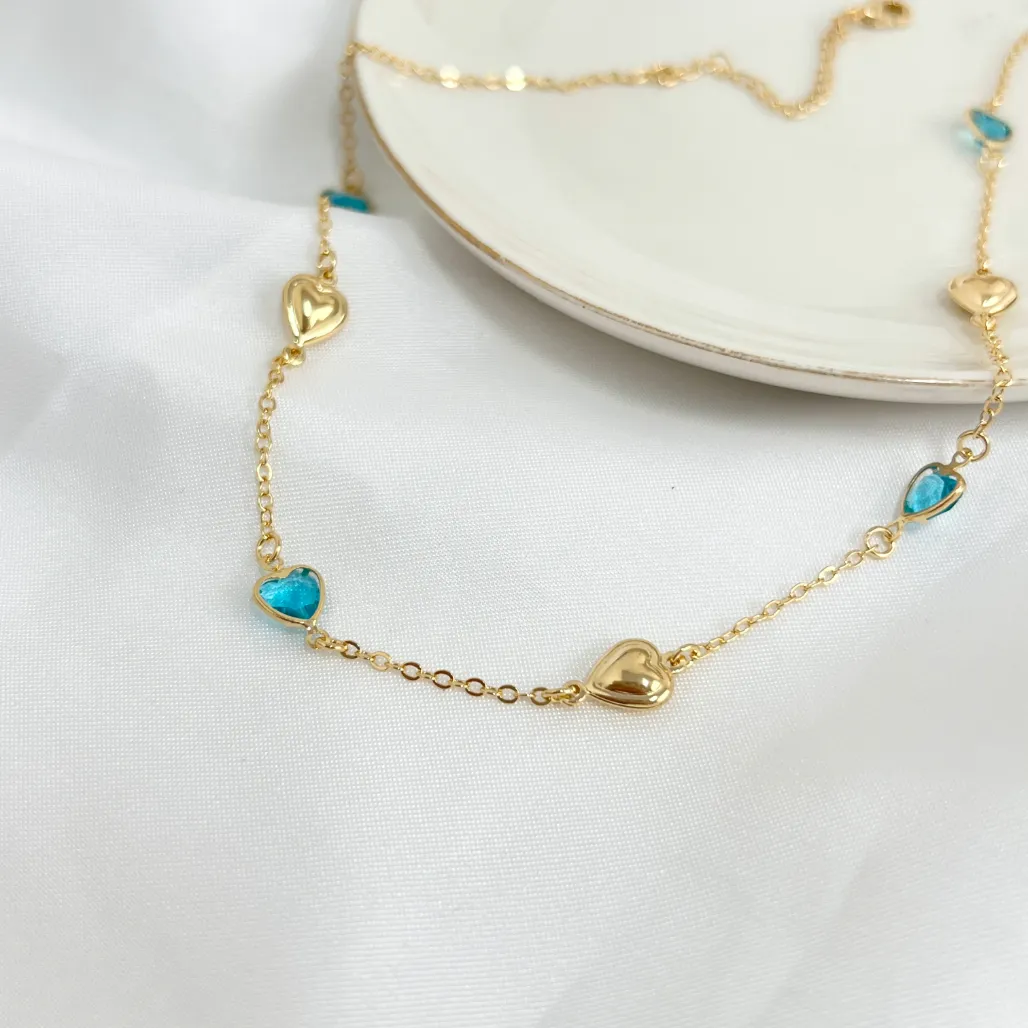 COLAR CHOKER CORAÇÕES DE PEDRA AZUL E DOURADOS 45CM