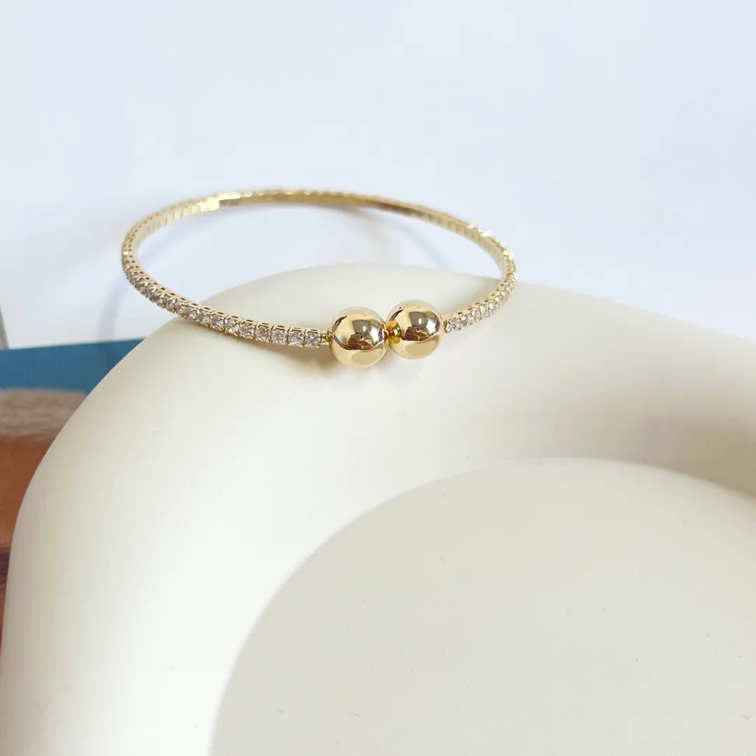 BRACELETE ABERTO RIVIERA COM BOLAS