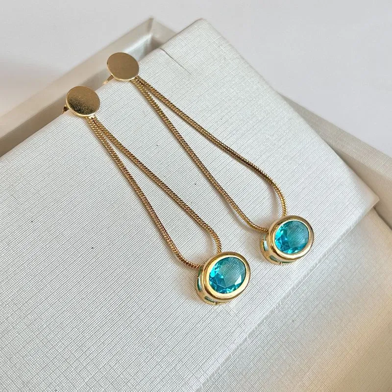 BRINCO LONGO RABO DE RATO COM PEDRA OVAL AZUL BRINCO LONGO RABO DE RATO COM PEDRA OVAL AZUL