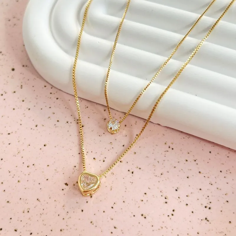 COLAR DUPLO PONTO DE LUZ E CORAÇÃO COLAR DUPLO PONTO DE LUZ E CORAÇÃO