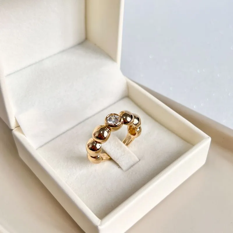 ANEL BOLAS COM PEDRA DE ZIRCONIA NO MEIO