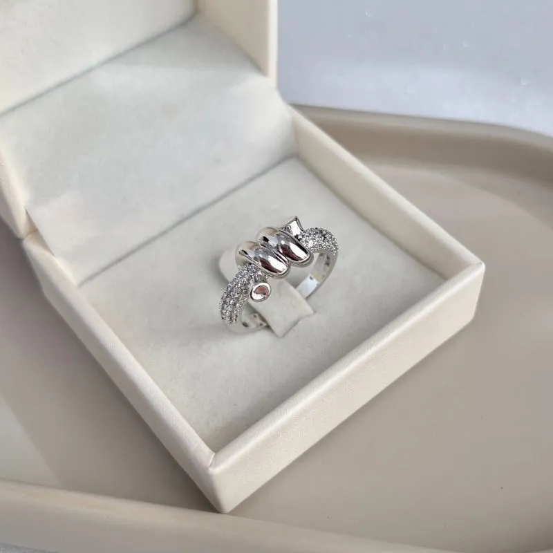 ANEL TORCIDO COM ARO DE MICRO ZIRCONIAS