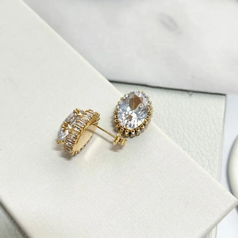 BRINCO PEDRA OVAL DE ZIRCONIA COM BAGUETES NAS BORDAS