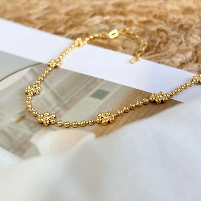 TORNOZELEIRA BOLINHA COM FORMATO DE FLORES