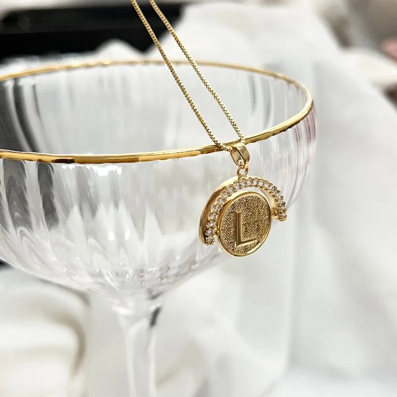 COLAR LETRA GIRATÓRIA ZIRCONIA CRISTAL - L